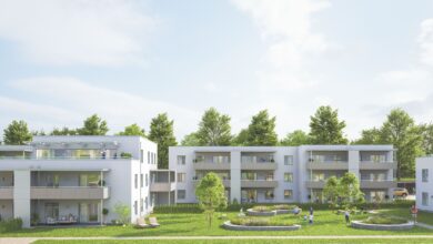 Rendering eines Wohnbaus im Grünen.